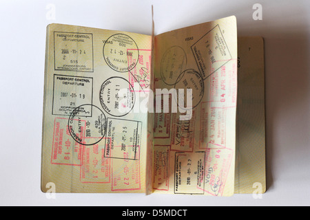 Fully stamped Visa pages in a Passport. Stock Photo