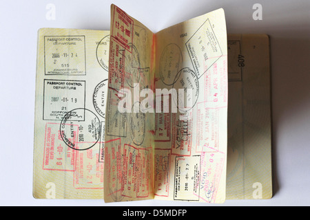 Fully stamped Visa pages in a Passport. Stock Photo