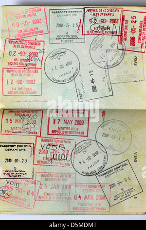 Fully stamped Visa pages in a Passport. Stock Photo