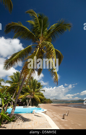 Madagascar, Nosy Be, Anjiamarango beach resort pool overlooking Befotaka Bay Stock Photo