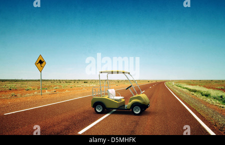 golf cart in a desert road Stock Photo