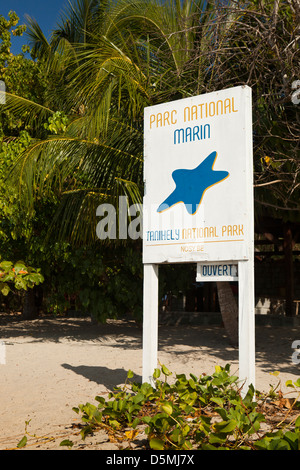 Madagascar, Nosy Be, Nosy Tanikely National Park Marine Reserve sign on main beach Stock Photo
