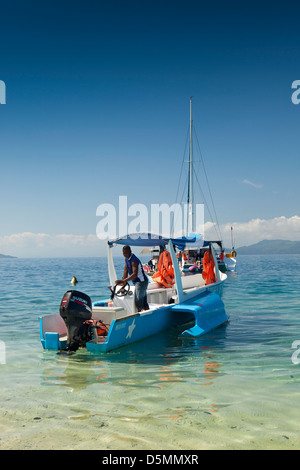 Madagascar, Nosy Be, Nosy Tanikely Marine Reserve, boats moored off main beach Stock Photo