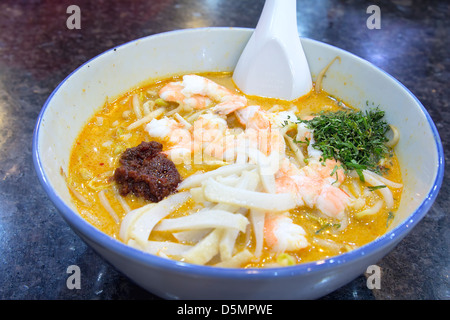 Singapore Curry Laska with Prawns Fishcake and Sambal Chili Paste Macro Stock Photo