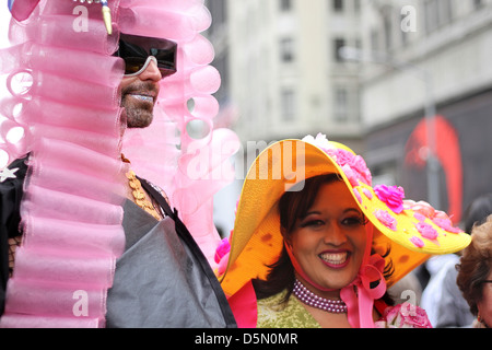 A man and woman wearing colorful hats and costumes for New York City's Easter Parade Stock Photo