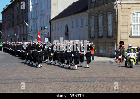 Copenhagen, Denmark. April 4th 2013. Cadets from the Royal Danish Naval Academy accompanied by the playing and singing Royal Danish Navy Band  entering the Amalienborg Palace Square during their “Flag on Board” parade through Copenhagen to mark the beginning of a new sailing season. Credit:  Niels Quist / Alamy Live News Stock Photo