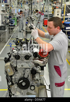 Sylvio Mueller assembles a petrol engine at the engine factory of the company MDC Power in Koelleda, Germany, 05 April 2013. On the same day, the production of the AMG 2,0-litre four-cylinder turbo engine started at the factory, where, according to Mercedes tradition, one mechanic assembles a whole engine. Photo: MARTIN SCHUTT Stock Photo