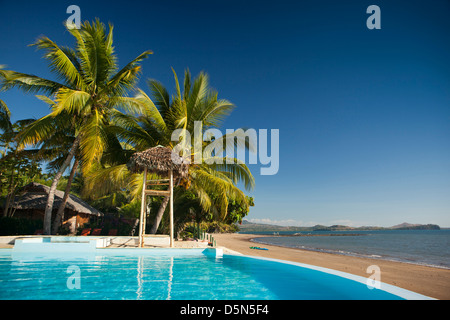 Madagascar, Nosy Be, Anjiamarango beach resort pool overlooking Befotaka Bay Stock Photo