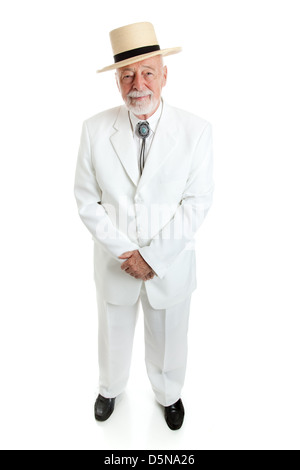 Handsome senior Southern gentleman in a white suit with a straw hat and a string tie. Full body isolated.  Stock Photo