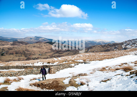 Snowy path up Cader Idris.  Snowdonia in the background. Stock Photo
