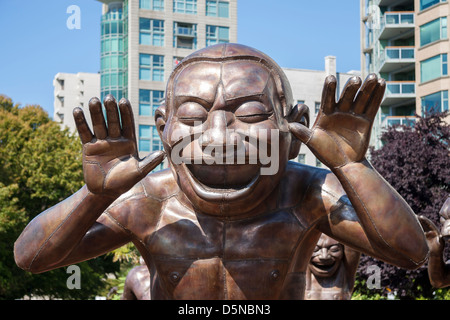 'A-maze-ing Laughter' cast-bronze statues by Chinese artist Yue Minjun in Vancouver, Canada Stock Photo