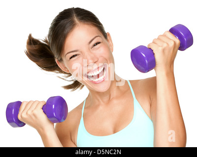 Portrait of happy young mixed race Asian Caucasian fitness woman lifting dumbbells isolated on white background Stock Photo