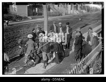 Thanksgiving Maskers scramble for pennies (LOC) Stock Photo