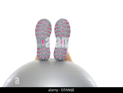 Closeup on leg laying on fitness ball Stock Photo