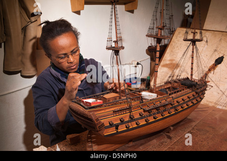 Madagascar, Antananarivo, Crafts, Le Village model boat making workshop, craftswoman Stock Photo