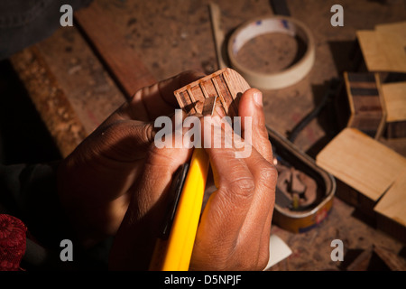 Madagascar, Antananarivo, Crafts, Le Village model boat making workshop, craftsman’s hands Stock Photo