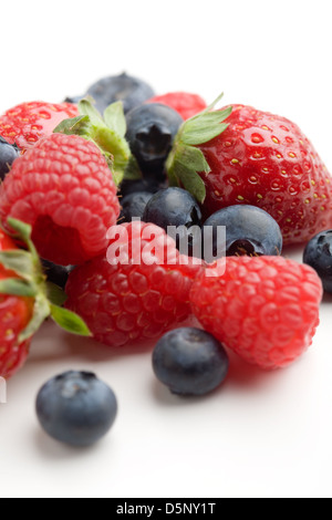 Strawberries, raspberries and blueberries on white Stock Photo