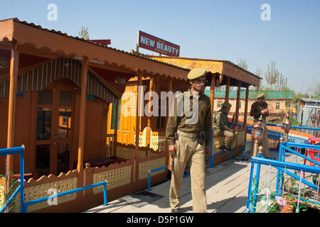 Kashmir, India. 6th April 2013. A policeman seals   the houseboat where a British woman was allegedly  murdered by a Dutch tourist on Saturday in Srinagar, the summer capital city of Indian-administered Kashmir . 24-year old  Sara Elizabeth was found in a pool of blood inside her room in the houseboat in the morning,  police said, adding she might have been raped before being killed as her clothes were torn. The Dutch tourist Davit Rechord (43), who was staying in another room of the houseboat has been arrested. Credit: yawar nazir kabli / Alamy Live News Stock Photo