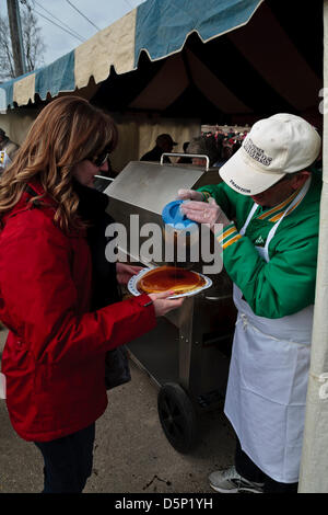 Elmira, Ontario, Canada. 6th April 2013. Elmira Maple Syrup Festival Elmira Ontario Canada  April 6 2013 Pouring maple syrup on pancakes. Performance Image / Alamy Live News Stock Photo