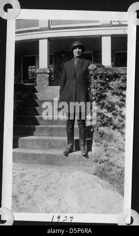 Helen Richey, a pioneering aviator, is seen outdoors in boots, jodhpurs ...