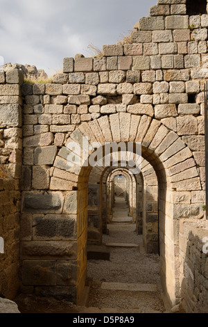 Stone block arches of the foundations of the Temple of Trajan archeological site at Pergamon Bergama Turkey Stock Photo