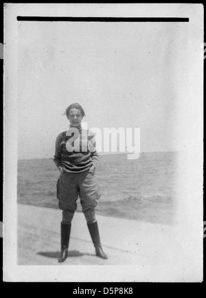 Helen Richey, a pioneering aviator, is seen outdoors in boots, jodhpurs ...