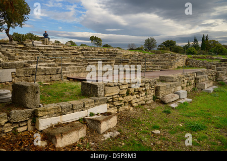 Man standing on top of the ancient Odeon theater archeological site of Troy at Hisarlik Turkey Stock Photo