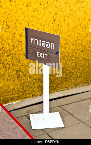 Exit signs. Mounted on white steel poles. Stock Photo