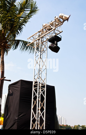 Spotlights mounted on steel poles. The sky in the background. Stock Photo