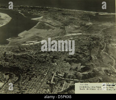 This aerial photograph of the Consolidated/Convair Aircraft Factory in San Diego shows the manufacturing site where significant aircraft were produced, including military and commercial aircraft. Lindbergh Field, now known as San Diego International Airport, served as a key location for early aviation efforts. Stock Photo
