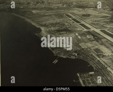 This aerial photograph shows the Consolidated/Convair aircraft factory near Lindbergh Field in San Diego. The factory was central to the development of key military and civilian aircraft during the mid-20th century. Stock Photo