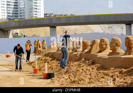 Brighton, Sussex, UK. 7th April 2013.  Fiinal touches are put to some of the figures at the sand Sculpture Festival 2013 which is being held in Brighton and this year has a musical theme . It is due to open to the public tomorrow. Stock Photo