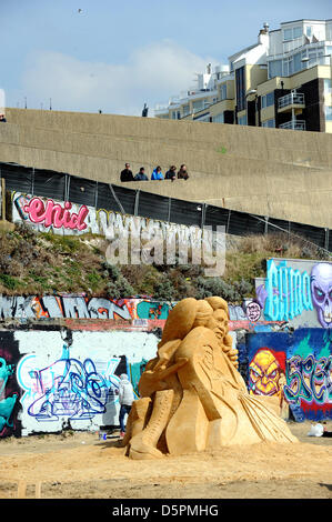 Brighton, Sussex, UK. 7th April 2013.  Fiinal touches are put to some of the figures at the sand Sculpture Festival 2013 which is being held in Brighton and this year has a musical theme . It is due to open to the public tomorrow. Stock Photo