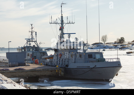 Liaison boats of the Finnish Navy surrounded by ice in April, waiting for the spring sailing season to begin. Stock Photo