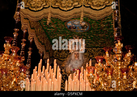 Virgin in procession on Easter Thursday in Holy Week of Malaga, Andalusia, Spain Stock Photo