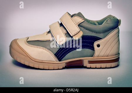 Old-fashioned sports shoe from synthetic leather Stock Photo