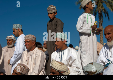 Omani men in the national costume Dishdasha and the kummah cap on the ...