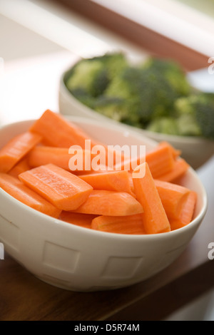 Young woman cooking healthy food with lots of vegetables Stock Photo