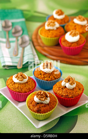 Cupcakes with carrots and walnuts. Recipe available. Stock Photo