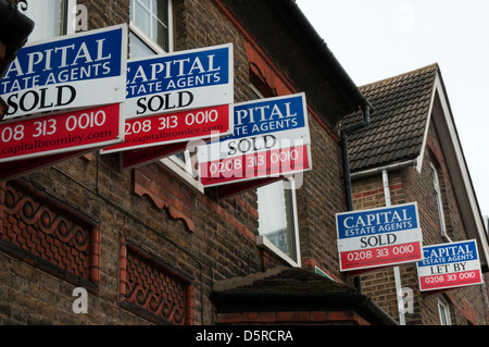 Sold signs on houses. Stock Photo