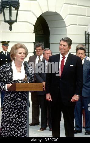File pics: Prime Minister Margaret Thatcher of the United Kingdom, left, makes remarks after visiting United States President Ronald Reagan, right, at the White House in Washington, D.C. on Friday, July 17, 1987. Thatcher died from a stroke at 87 on Monday, April 8, 2013. Credit: Howard L. Sachs - CNP/Alamy Live News Stock Photo