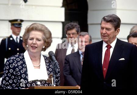 File pics: Prime Minister Margaret Thatcher of the United Kingdom, left, makes remarks after visiting United States President Ronald Reagan, right, at the White House in Washington, D.C. on Friday, July 17, 1987. Thatcher died from a stroke at 87 on Monday, April 8, 2013. Credit: Howard L. Sachs - CNP/Alamy Live News Stock Photo