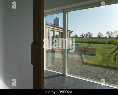 Woodfield House, Enfield, Ireland. Architect: Patrick Gilsenan Architect, 2011. View from corridor window to garden. Stock Photo