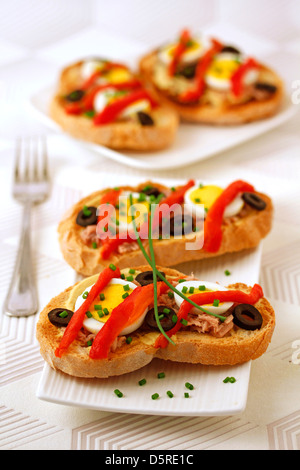 Bruschettas with tuna and peppers. Recipe available Stock Photo