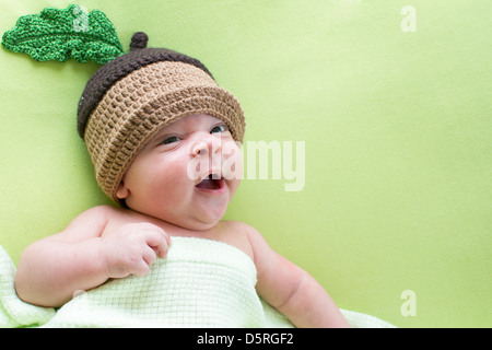 baby baby weared in acorn hats Stock Photo
