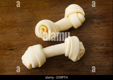 Artificial a bone for dog on wooden Stock Photo