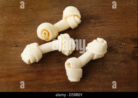 Artificial a bone for dog on wooden background Stock Photo