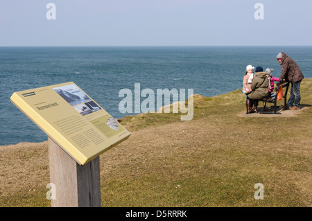 People enjoying the view from Ramore Head at Portrush Stock Photo