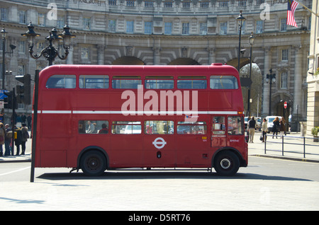 Red London Bus with Admiralty Arch in the background. Stock Photo