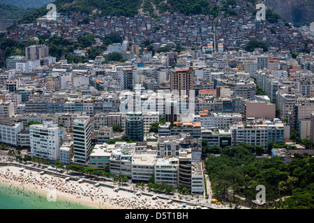 Ipanema upper-middle-class neighborhood in Rio de Janeiro Brazil Cantagalo favela in gbackground Arpoador beach in foreground Stock Photo